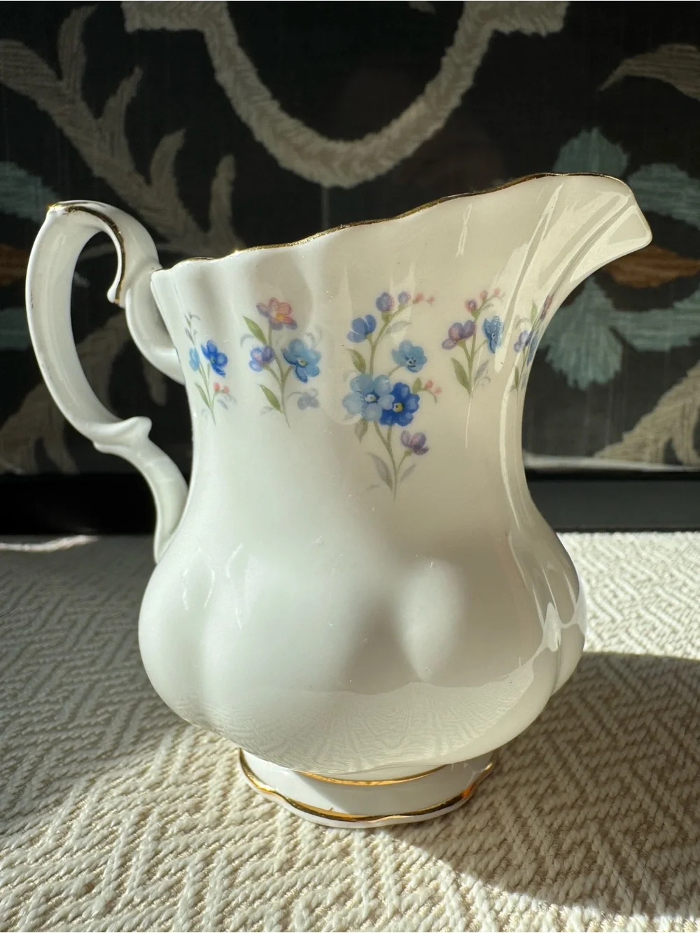 Royal Albert White Porcelain Creamer with Blue Floral Motif and Gold Trim